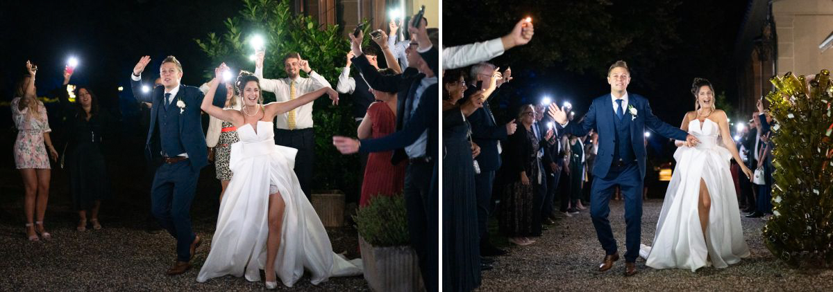les mariés dans la haie d'honneur à la soirée du mariage au château des comtes de challes